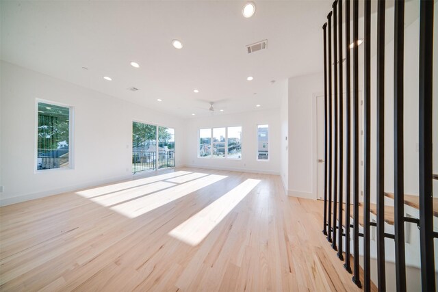 3821 Munger Ave Unit 105, Dallas, TX 75204 - unfurnished living room with light wood-style flooring and recessed lighting