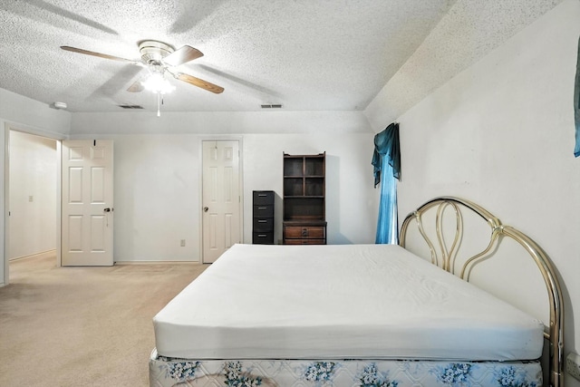 1419 Juniper Ln, Lewisville, TX 75077 - bedroom with light carpet, a textured ceiling, and ceiling fan
