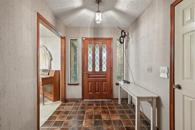 1419 Juniper Ln, Lewisville, TX 75077 - foyer with a textured ceiling and a textured wall