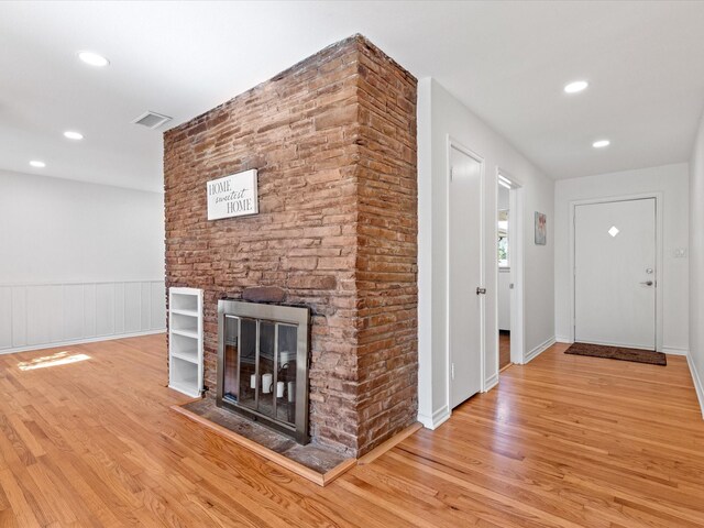 4608 Winthrop Ave E, Fort Worth, TX 76116 - unfurnished living room with wood finished floors, recessed lighting, and a fireplace