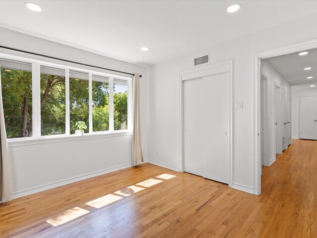 4608 Winthrop Ave E, Fort Worth, TX 76116 - unfurnished bedroom featuring recessed lighting, light wood-style flooring, and a closet