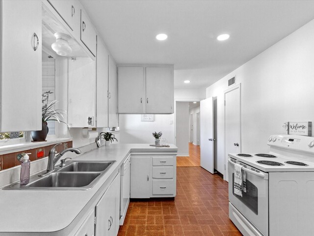 4608 Winthrop Ave E, Fort Worth, TX 76116 - kitchen featuring white appliances, light countertops, recessed lighting, white cabinetry, and brick patterned flooring