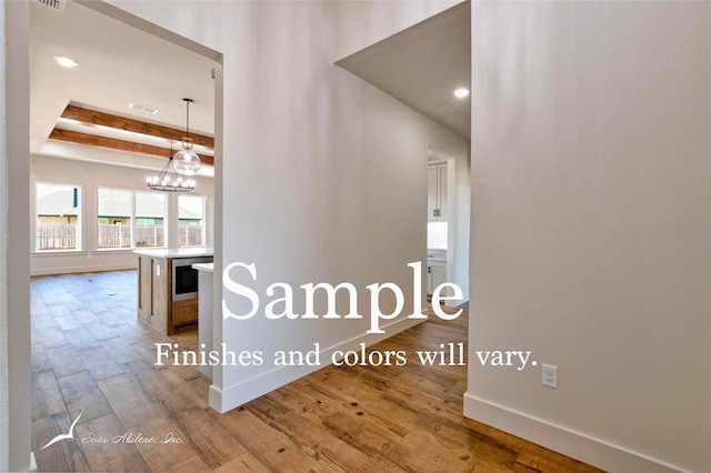 6602 Beals Creek Dr, Abilene, TX 79606 - hall featuring wood finished floors, a chandelier, beamed ceiling, and recessed lighting