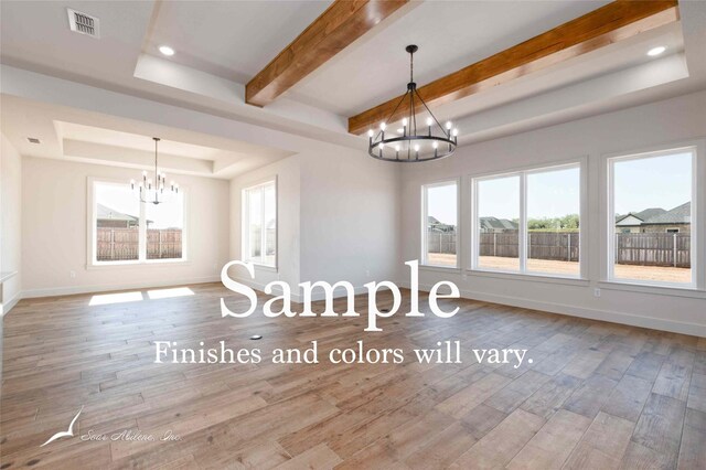 6602 Beals Creek Dr, Abilene, TX 79606 - empty room with a chandelier, a tray ceiling, plenty of natural light, wood finished floors, and beam ceiling