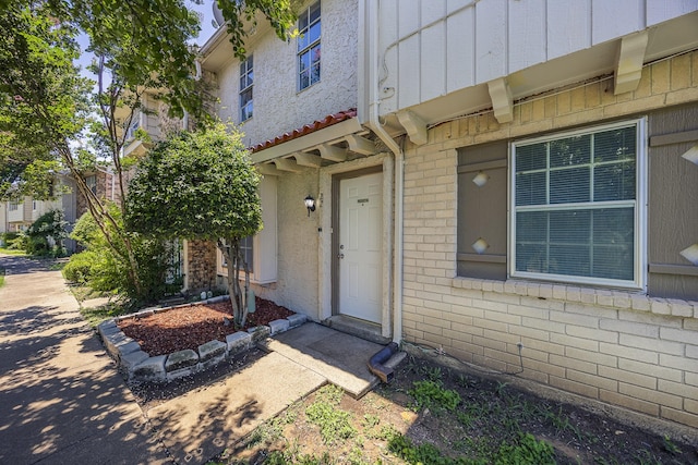 22 W Townhouse Ln Unit 34, Grand Prairie, TX 75052 - entrance to property with board and batten siding and brick siding