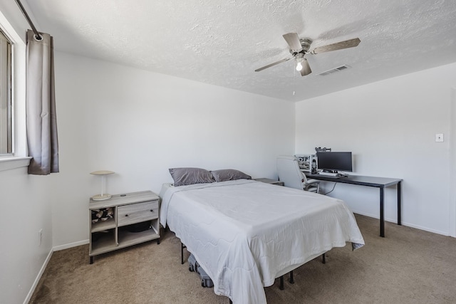 22 W Townhouse Ln Unit 34, Grand Prairie, TX 75052 - bedroom featuring a textured ceiling, carpet floors, and ceiling fan
