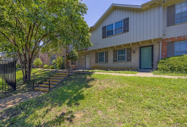 22 W Townhouse Ln Unit 34, Grand Prairie, TX 75052 - view of property with brick siding and stairway