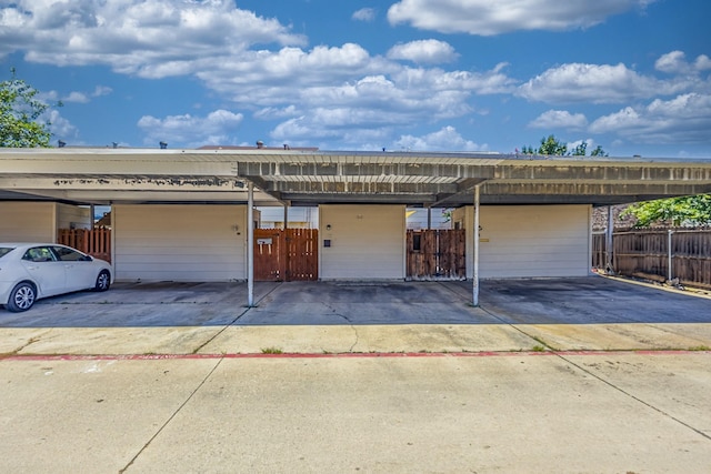 22 W Townhouse Ln Unit 34, Grand Prairie, TX 75052 - garage featuring covered parking