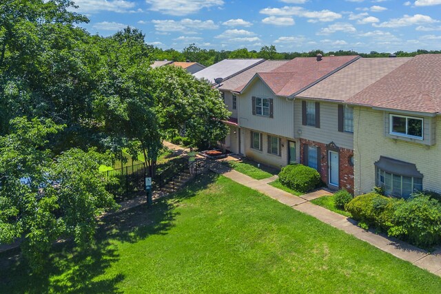 22 W Townhouse Ln Unit 34, Grand Prairie, TX 75052 - view of front facade featuring brick siding and a shingled roof