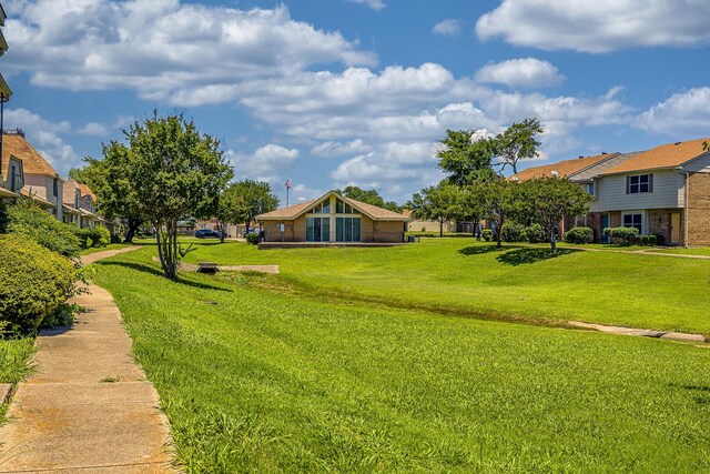 22 W Townhouse Ln Unit 34, Grand Prairie, TX 75052 - view of home's community featuring a residential view and a lawn