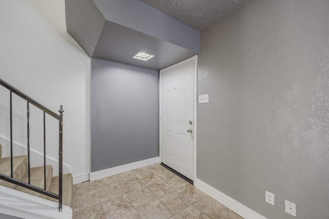 22 W Townhouse Ln Unit 34, Grand Prairie, TX 75052 - foyer featuring baseboards and stairway