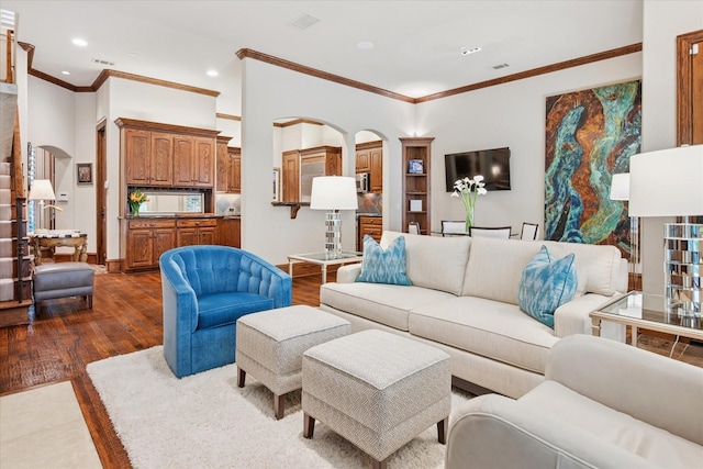 17227 Lechlade Ln, Dallas, TX 75252 - living room featuring arched walkways, dark wood-style flooring, ornamental molding, and recessed lighting