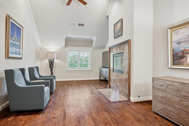 17227 Lechlade Ln, Dallas, TX 75252 - living area with ornamental molding, a ceiling fan, dark wood finished floors, high vaulted ceiling, and a high end fireplace