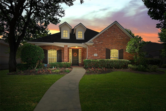 2413 Bachman Dr, Flower Mound, TX 75028 - traditional home with brick siding, a lawn, and a shingled roof