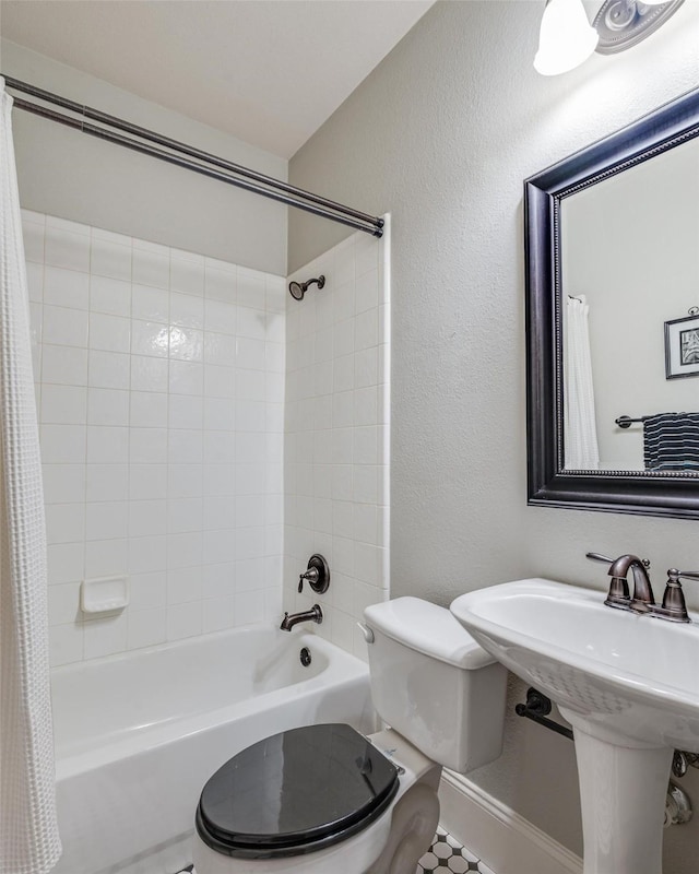 2413 Bachman Dr, Flower Mound, TX 75028 - bathroom featuring shower / bathtub combination with curtain and a textured wall