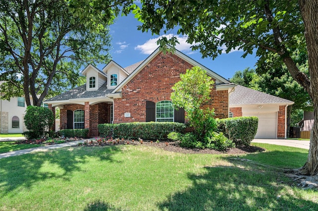 2413 Bachman Dr, Flower Mound, TX 75028 - traditional home featuring brick siding, a garage, a front yard, and a shingled roof