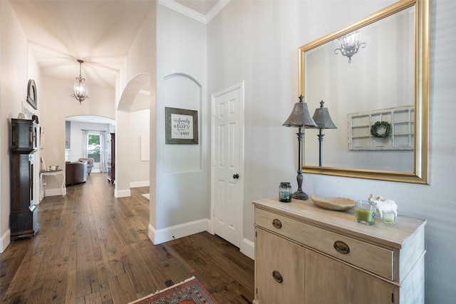 2413 Bachman Dr, Flower Mound, TX 75028 - corridor with arched walkways, dark wood-type flooring, and ornamental molding