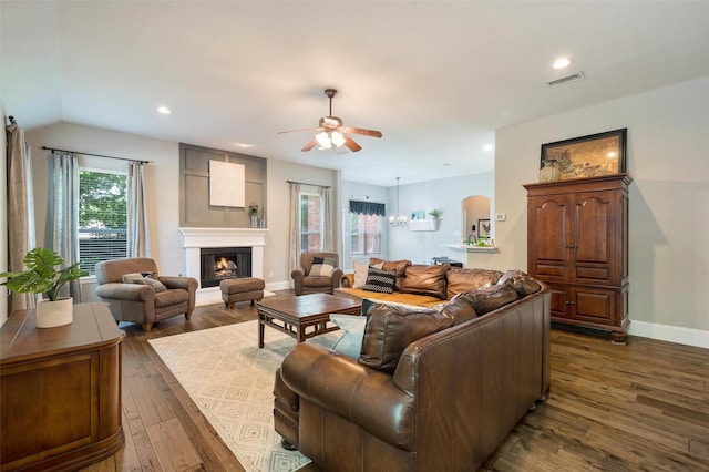2413 Bachman Dr, Flower Mound, TX 75028 - living room featuring dark wood finished floors, ceiling fan, a glass covered fireplace, recessed lighting, and vaulted ceiling