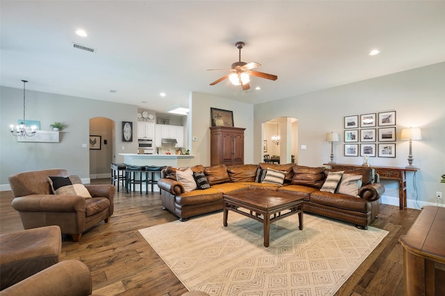 2413 Bachman Dr, Flower Mound, TX 75028 - living area with arched walkways, a chandelier, wood finished floors, ceiling fan, and recessed lighting