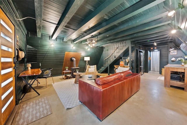 120 Lakeway Ln, Gun Barrel City, TX 75156 - living area featuring finished concrete floors, stairs, wood walls, beamed ceiling, and ceiling fan