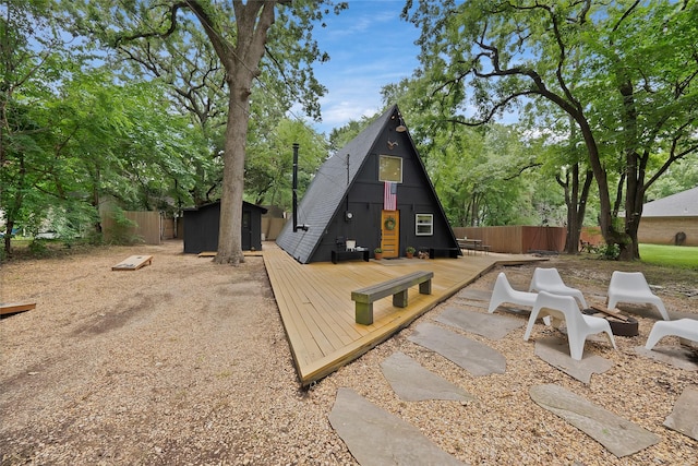 120 Lakeway Ln, Gun Barrel City, TX 75156 - rear view of house featuring a deck and a storage unit