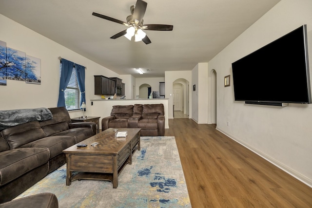 5921 Obsidian Creek Dr, Fort Worth, TX 76179 - living room with arched walkways, a ceiling fan, and wood finished floors