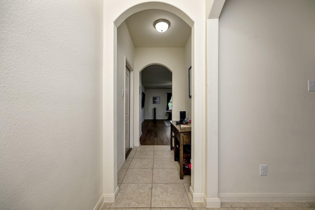 5921 Obsidian Creek Dr, Fort Worth, TX 76179 - hall with arched walkways and light tile patterned floors