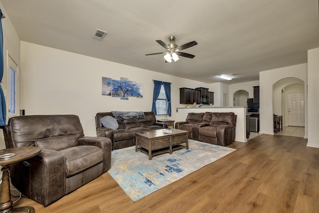 5921 Obsidian Creek Dr, Fort Worth, TX 76179 - living room with arched walkways, a ceiling fan, and wood finished floors