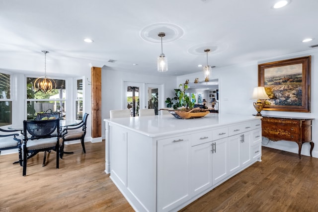 9867 Dripping Springs Rd, Denison, TX 75021 - kitchen featuring light wood-style flooring, white cabinets, a chandelier, recessed lighting, and crown molding