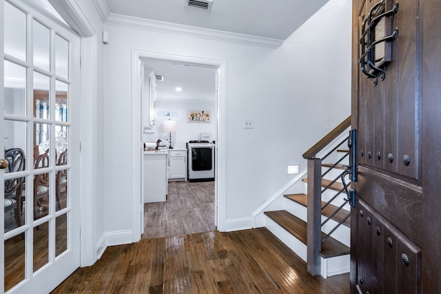 9867 Dripping Springs Rd, Denison, TX 75021 - foyer with washer / clothes dryer, crown molding, dark wood-style floors, and stairway
