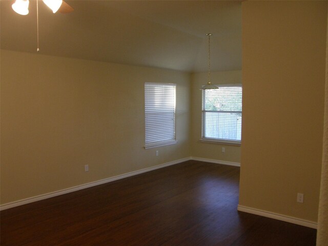 5905 Pacers Ln, Fort Worth, TX 76179 - spare room featuring dark wood-style flooring, ceiling fan, and vaulted ceiling