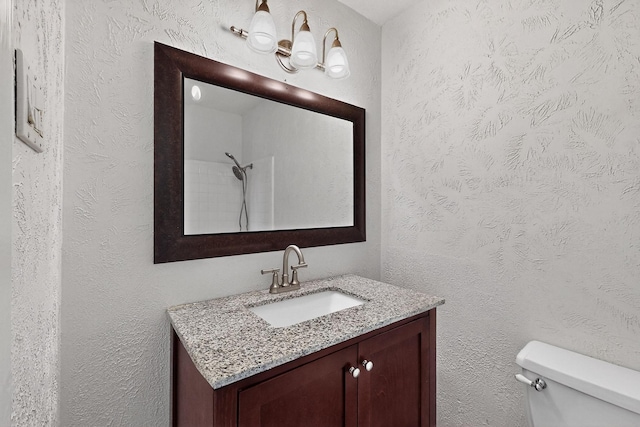 1225 Briarcove Dr, Richardson, TX 75081 - bathroom featuring vanity and a textured wall
