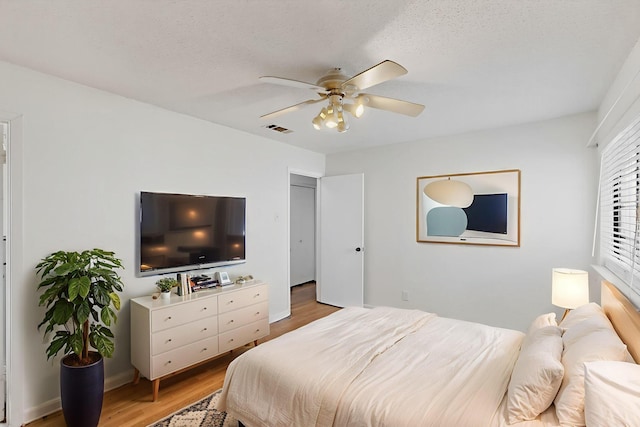 1225 Briarcove Dr, Richardson, TX 75081 - bedroom featuring light wood-style floors and ceiling fan