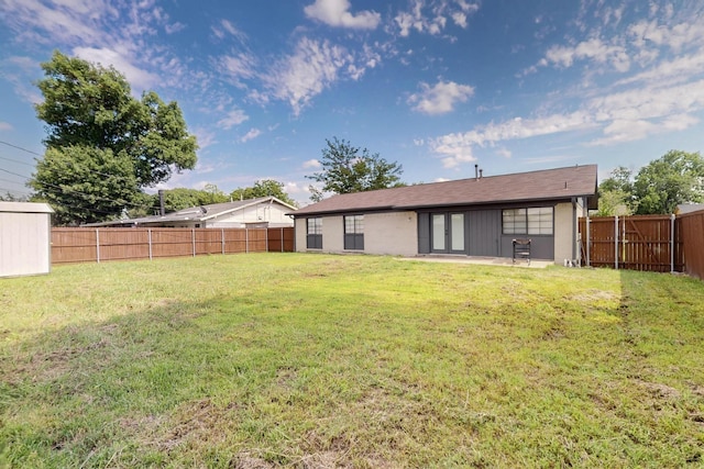 1225 Briarcove Dr, Richardson, TX 75081 - back of house with a fenced backyard, a patio, and french doors