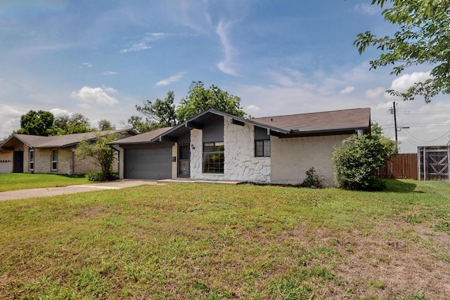 1225 Briarcove Dr, Richardson, TX 75081 - mid-century modern home featuring driveway, a garage, and stone siding