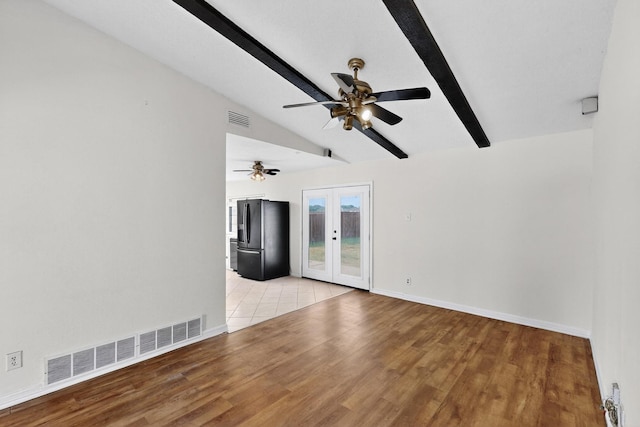 1225 Briarcove Dr, Richardson, TX 75081 - spare room with french doors, ceiling fan, and light wood-style flooring