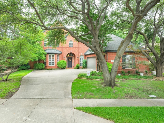 2903 Moss Creek Ct, Mckinney, TX 75072 - traditional-style house with brick siding, concrete driveway, a front yard, and a garage
