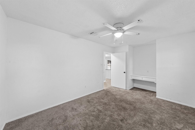 202 Lee Ln, Lorena, TX 76655 - unfurnished bedroom with carpet, a textured ceiling, and a ceiling fan
