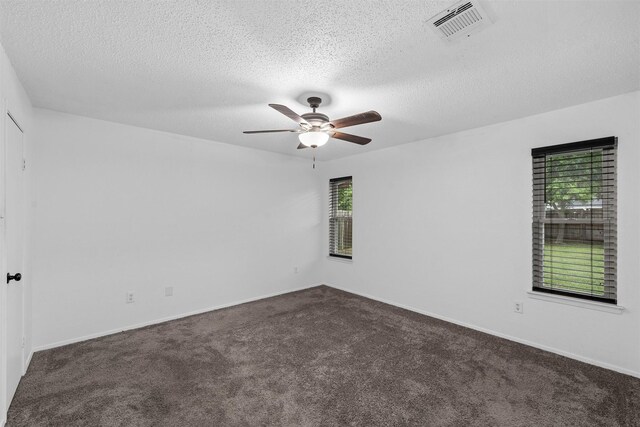 202 Lee Ln, Lorena, TX 76655 - spare room with dark carpet, ceiling fan, healthy amount of natural light, and a textured ceiling