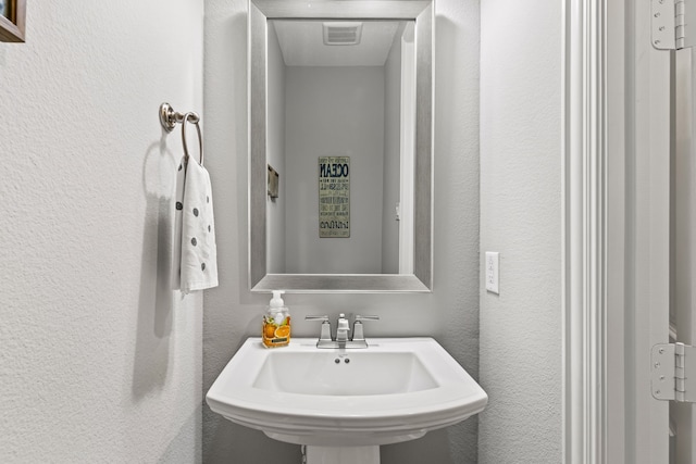 1861 Snapdragon Rd, Frisco, TX 75033 - bathroom with a sink and a textured wall