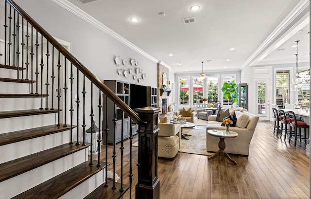 1861 Snapdragon Rd, Frisco, TX 75033 - living area with stairway, dark wood-type flooring, recessed lighting, and crown molding
