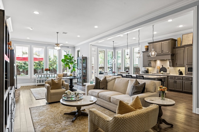 1861 Snapdragon Rd, Frisco, TX 75033 - living room with ceiling fan, wood-type flooring, healthy amount of natural light, recessed lighting, and crown molding