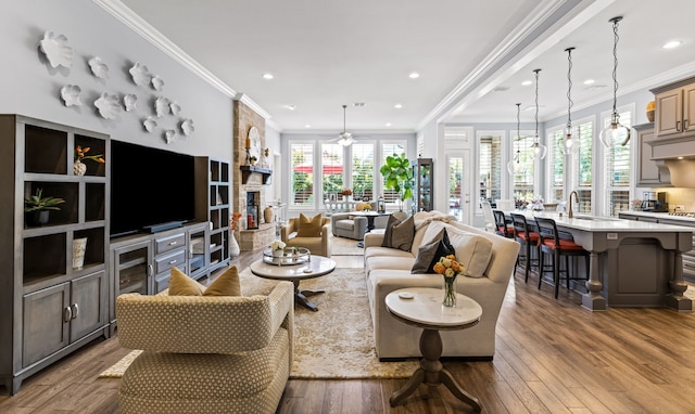 1861 Snapdragon Rd, Frisco, TX 75033 - living room with dark wood finished floors, crown molding, recessed lighting, and ceiling fan