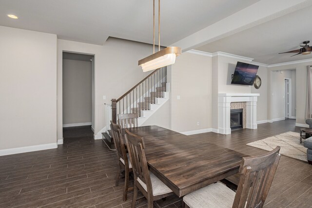 4001 Bamboo Trl, Mckinney, TX 75071 - dining room featuring wood finished floors, ceiling fan, stairway, a tiled fireplace, and recessed lighting
