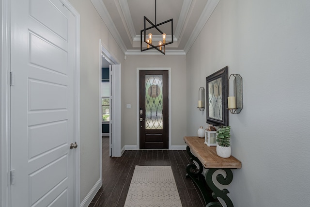 4001 Bamboo Trl, Mckinney, TX 75071 - foyer entrance with crown molding, a chandelier, and dark wood-style flooring