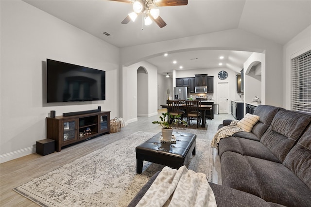 1501 Birdsong Ct, Midlothian, TX 76065 - living area featuring arched walkways, lofted ceiling, a ceiling fan, light wood-style flooring, and recessed lighting