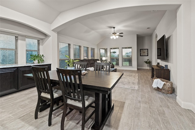 1501 Birdsong Ct, Midlothian, TX 76065 - dining room with light wood-style floors, lofted ceiling, a ceiling fan, and arched walkways