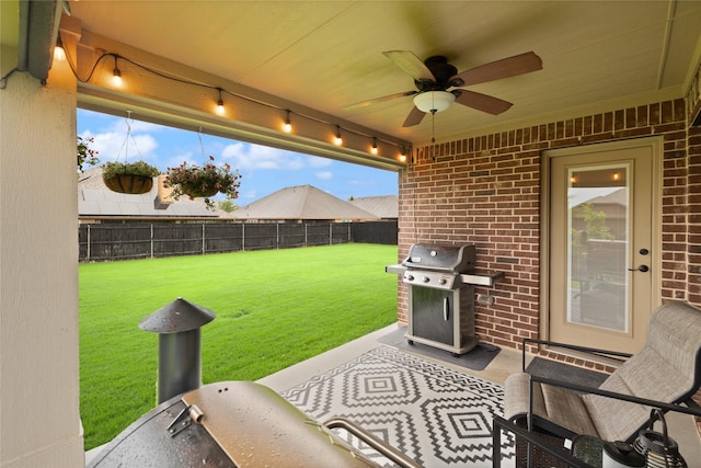 1501 Birdsong Ct, Midlothian, TX 76065 - fenced backyard featuring a grill, a ceiling fan, and a patio
