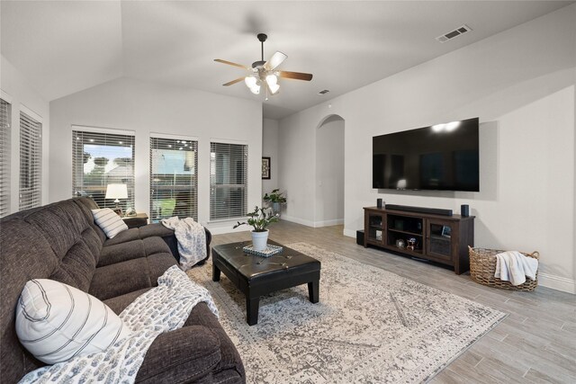1501 Birdsong Ct, Midlothian, TX 76065 - living room with a ceiling fan, wood finished floors, arched walkways, and lofted ceiling