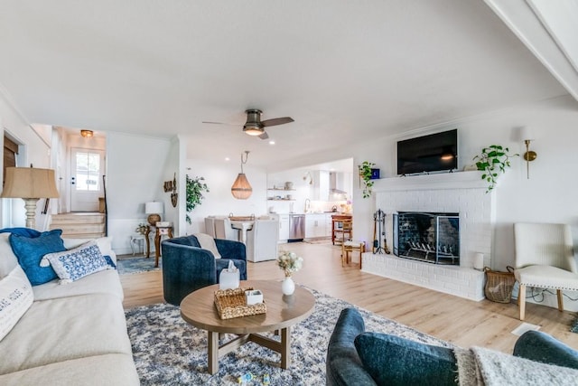 105 Causeway Ct, Gun Barrel City, TX 75156 - living room with wood finished floors, ceiling fan, and a fireplace